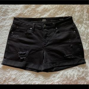Mid rise black ripped denim shorts